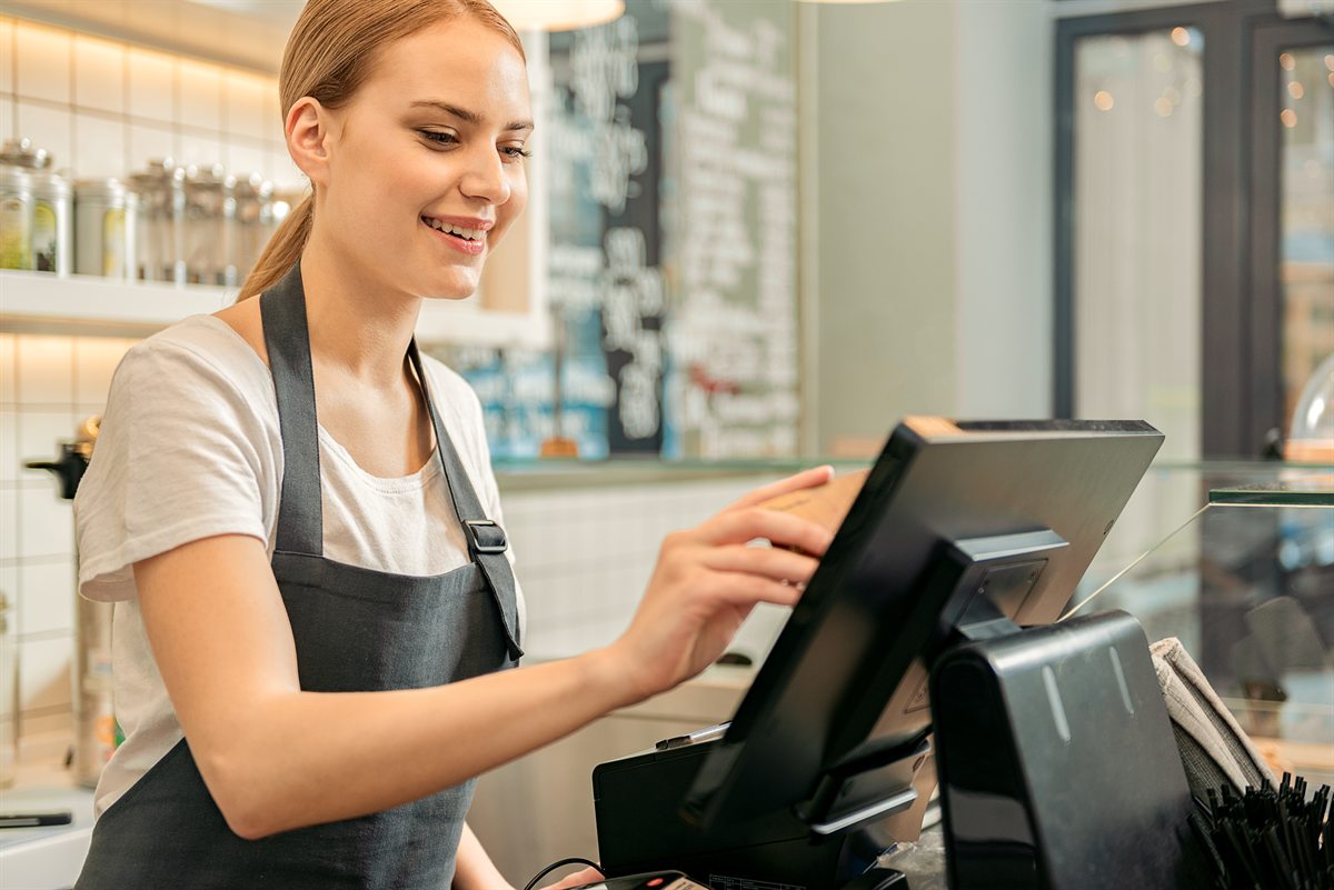 Shop assistant using a POS terminal