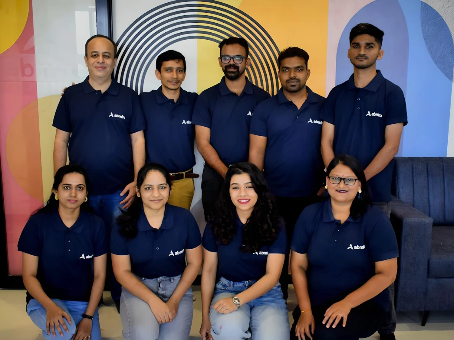 Members of the Postree team in branded polo shirts