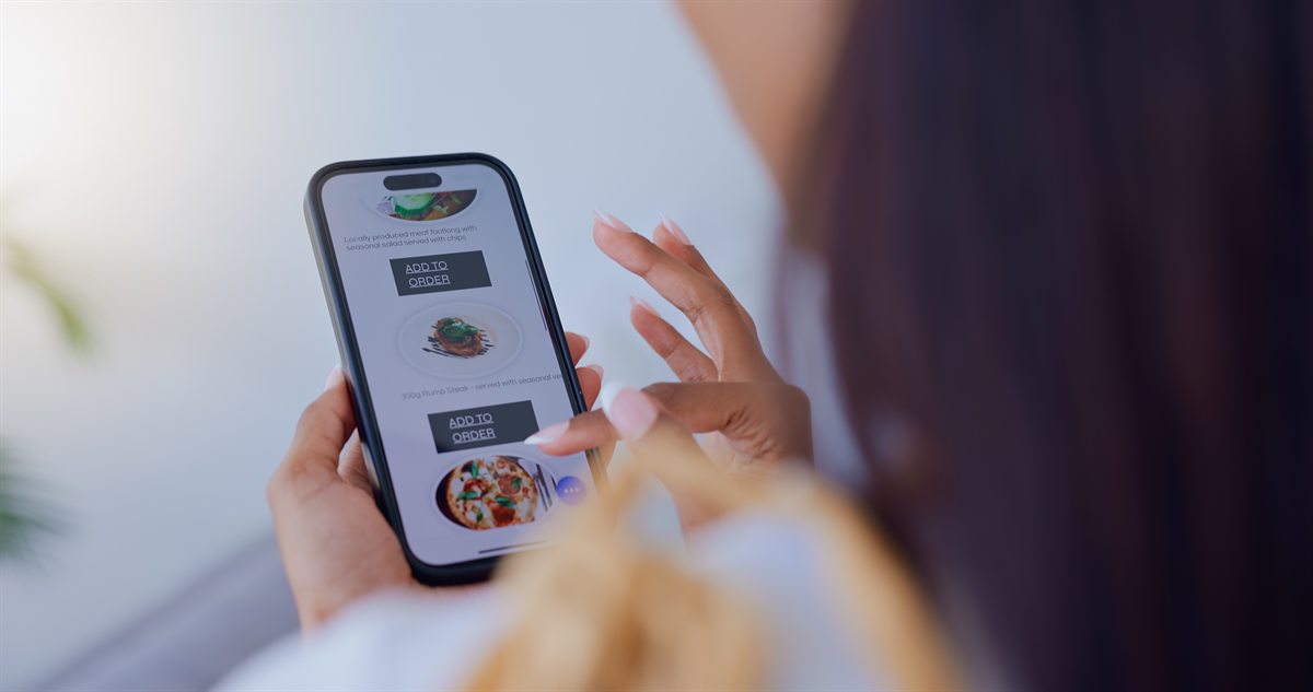 Woman ordering food from a restaurant menu on her smartphone