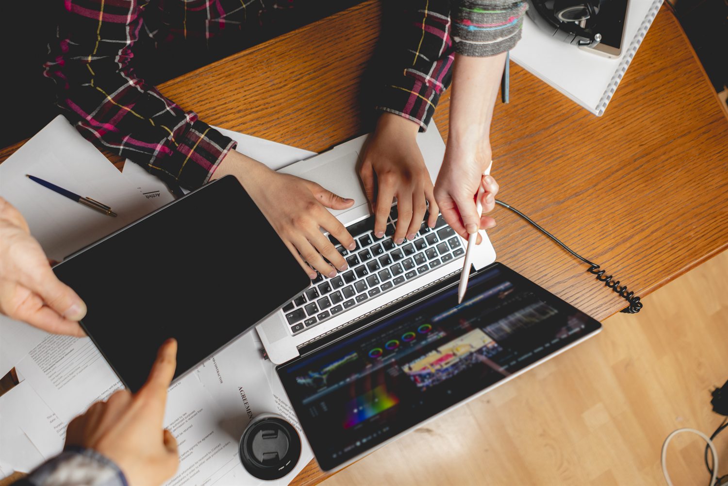 Team working on a custom website design on a laptop